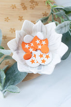 Load image into Gallery viewer, TN &amp; Nash Cut Out Tri Star Dangles: Orange/White Stud