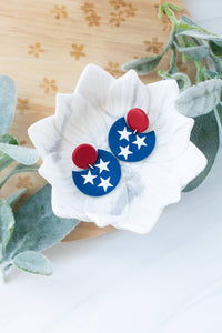 TN & Nash Cut Out Tri Star Dangles: Orange/White Stud